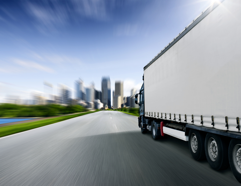 Truck moving materials to the city