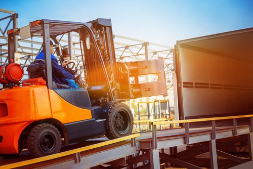 forklift driving into truck