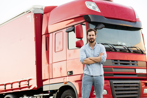 man standing in front of red truck