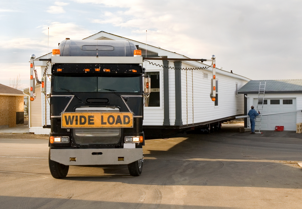 truck with wide load sign shipping over dimensional transport