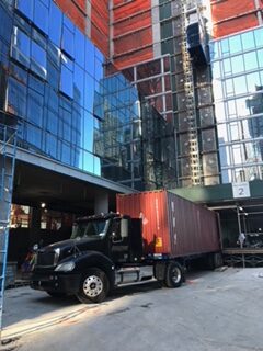 Flatbed trailer with shipping container