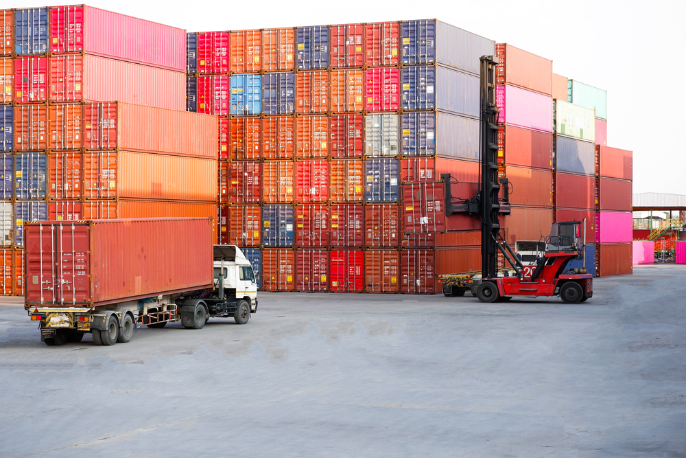 Container handlers and trucks In the loading and unloading yard